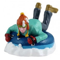 Enfant en bouée sur neige LEMAX